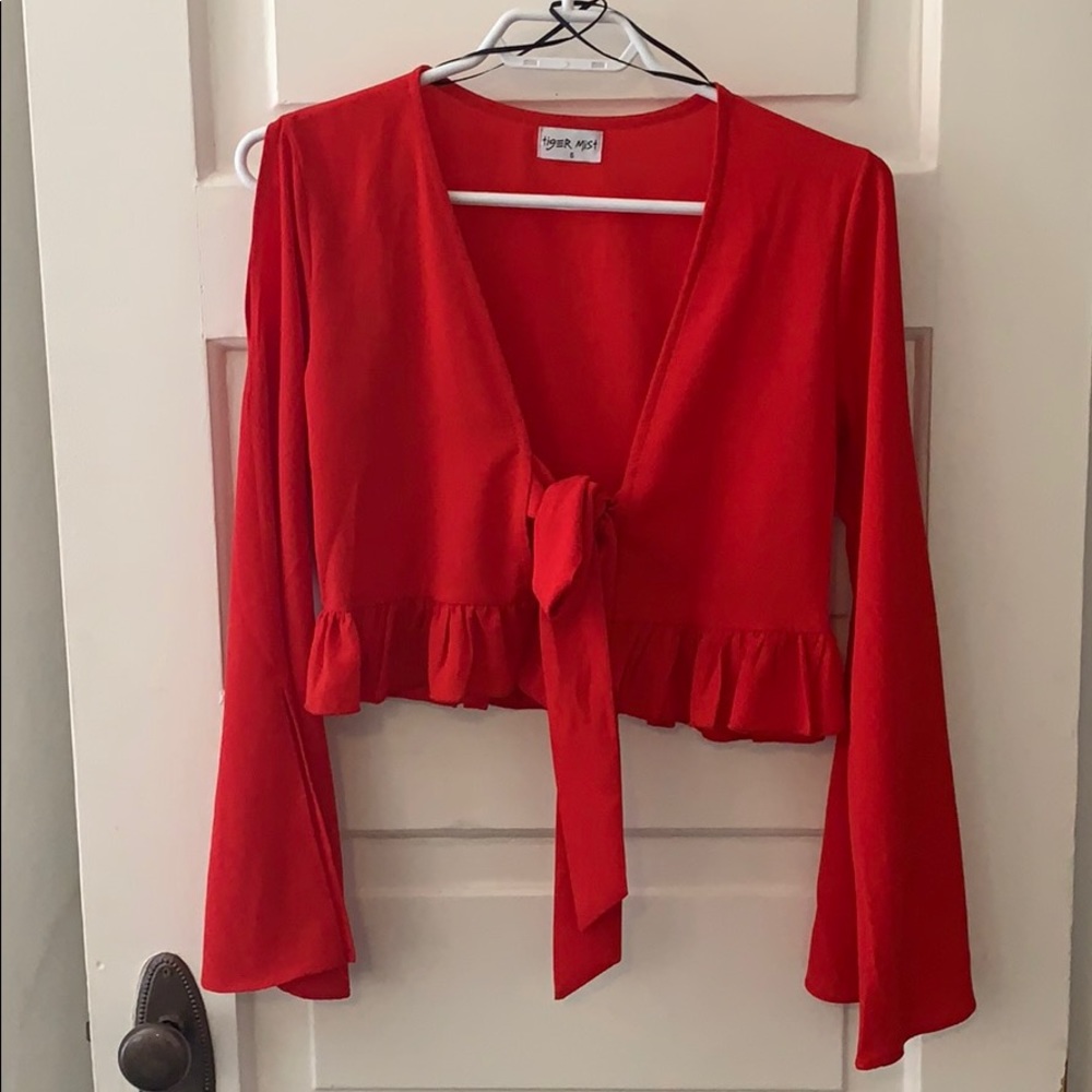 Tigermist Ruffle Front Tie Top!